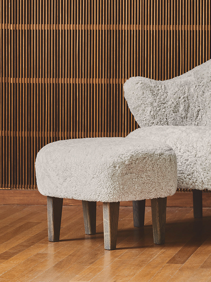 Compact Ottoman in Sheepskin Pairs with Lounge Chair