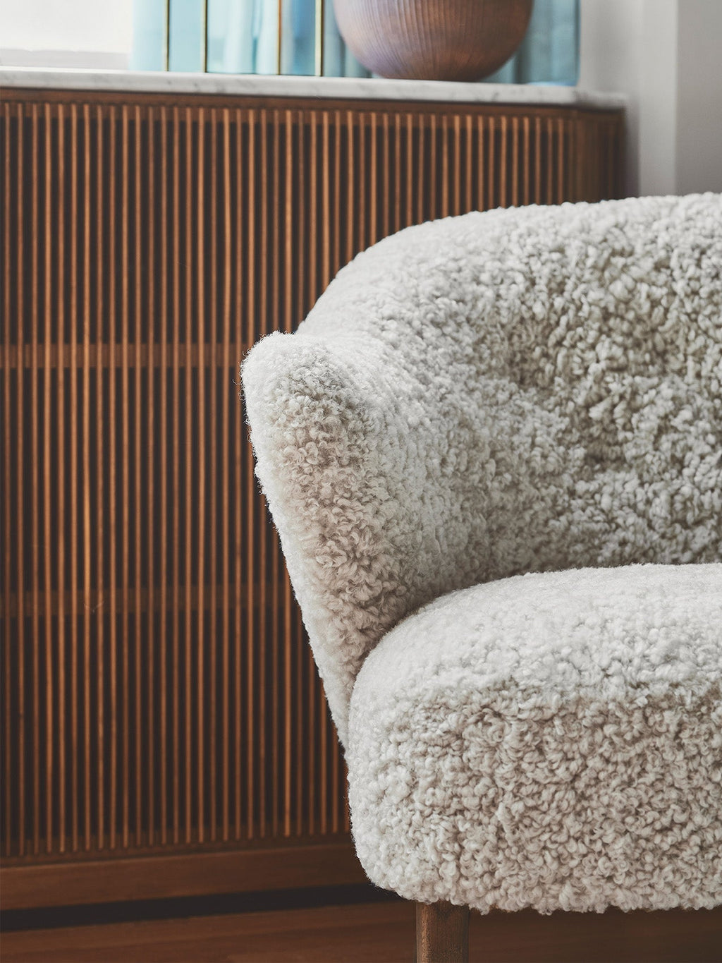 Compact Ottoman in Sheepskin Pairs with Lounge Chair