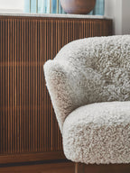 Compact Ottoman in Sheepskin Pairs with Lounge Chair