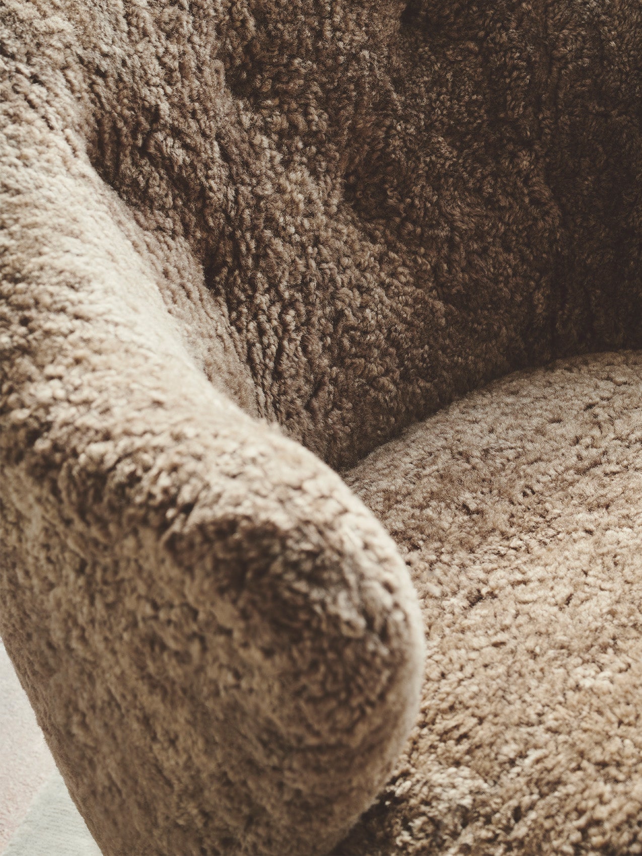 Compact Lounge Chair in Sheepskin Sculptural Armrests